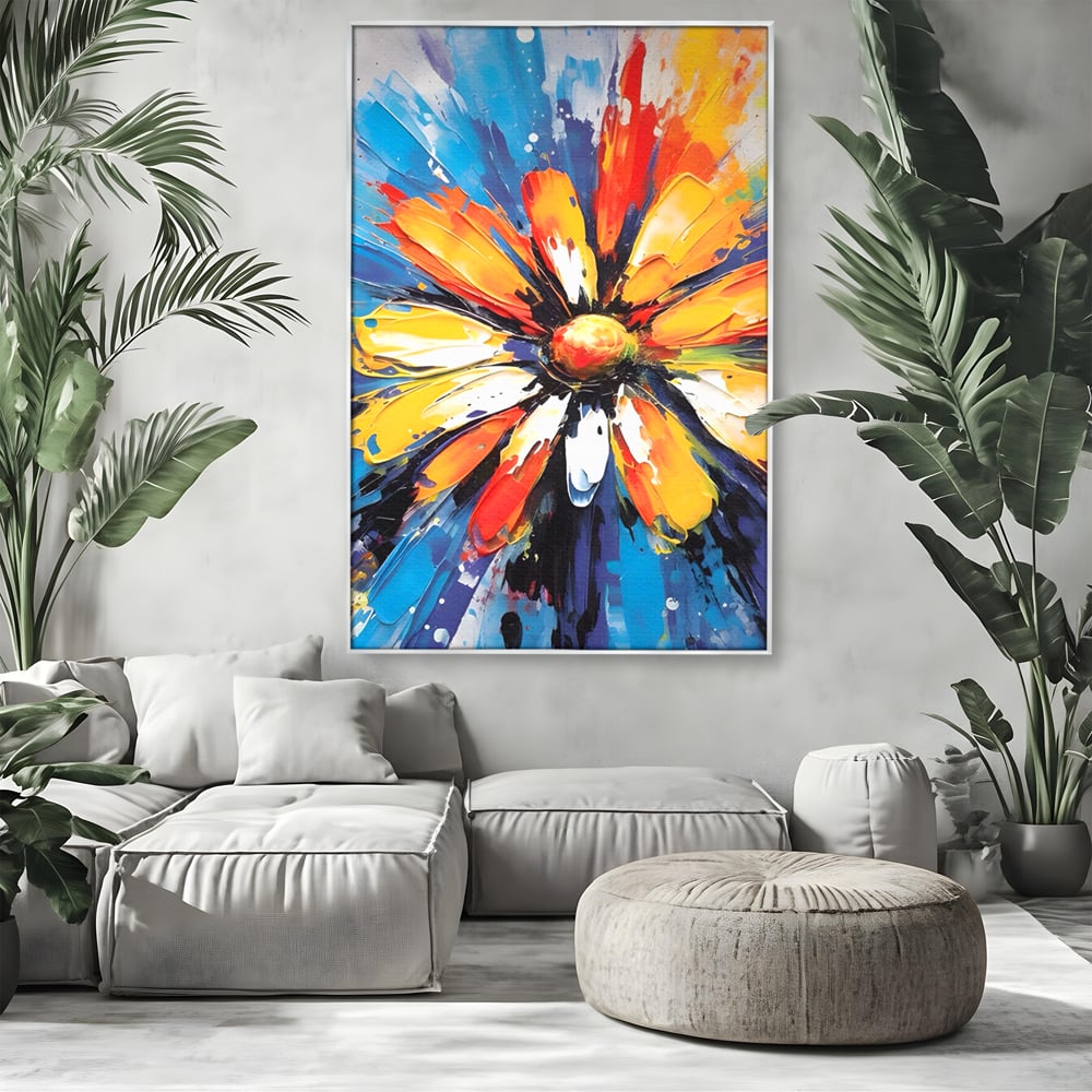 Tablou canvas cu pictura abstracta cu floare colorata, in rama de aluminiu argintiu, pe perete intr-un living